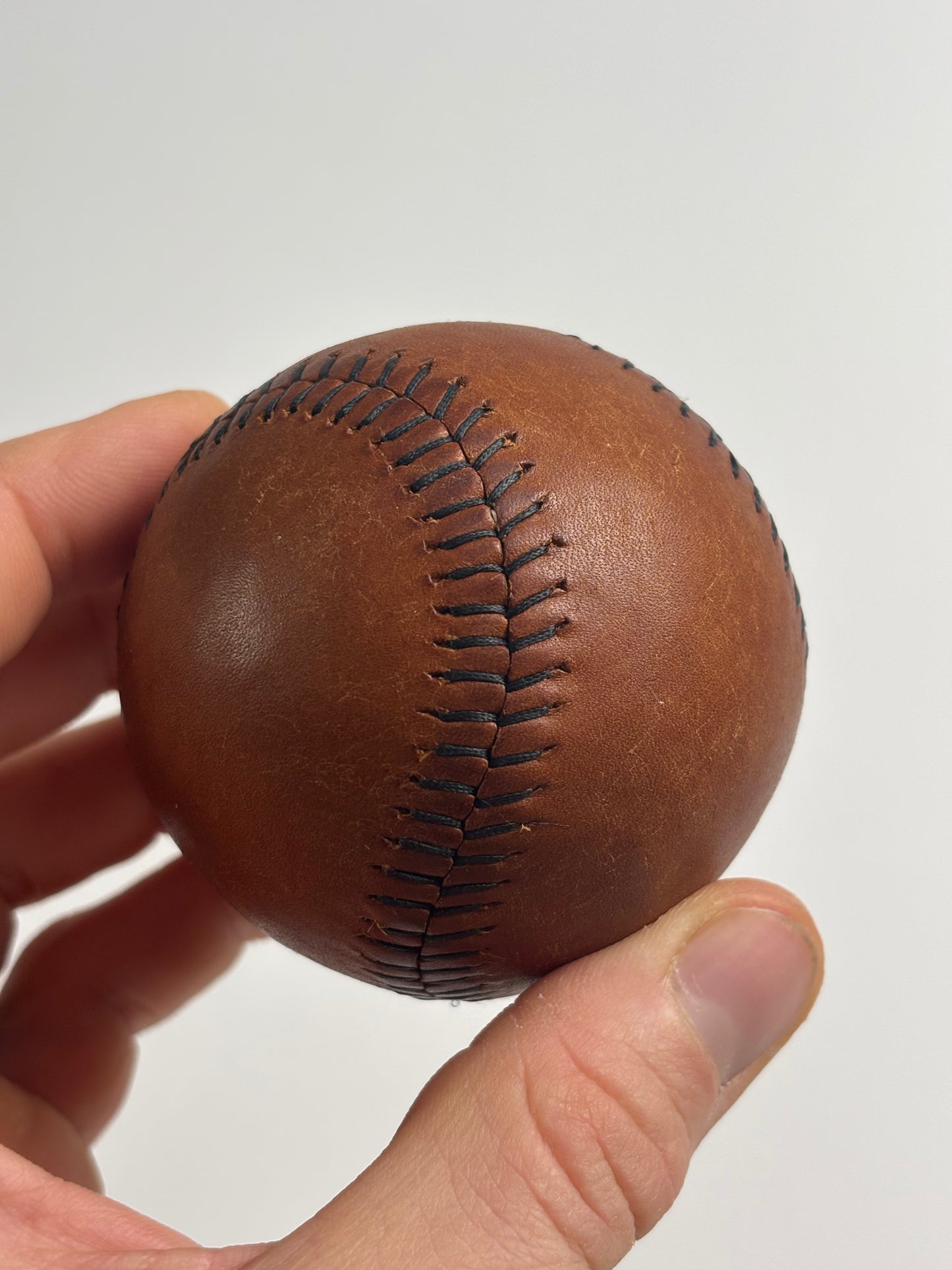 Hand stitched leather baseball