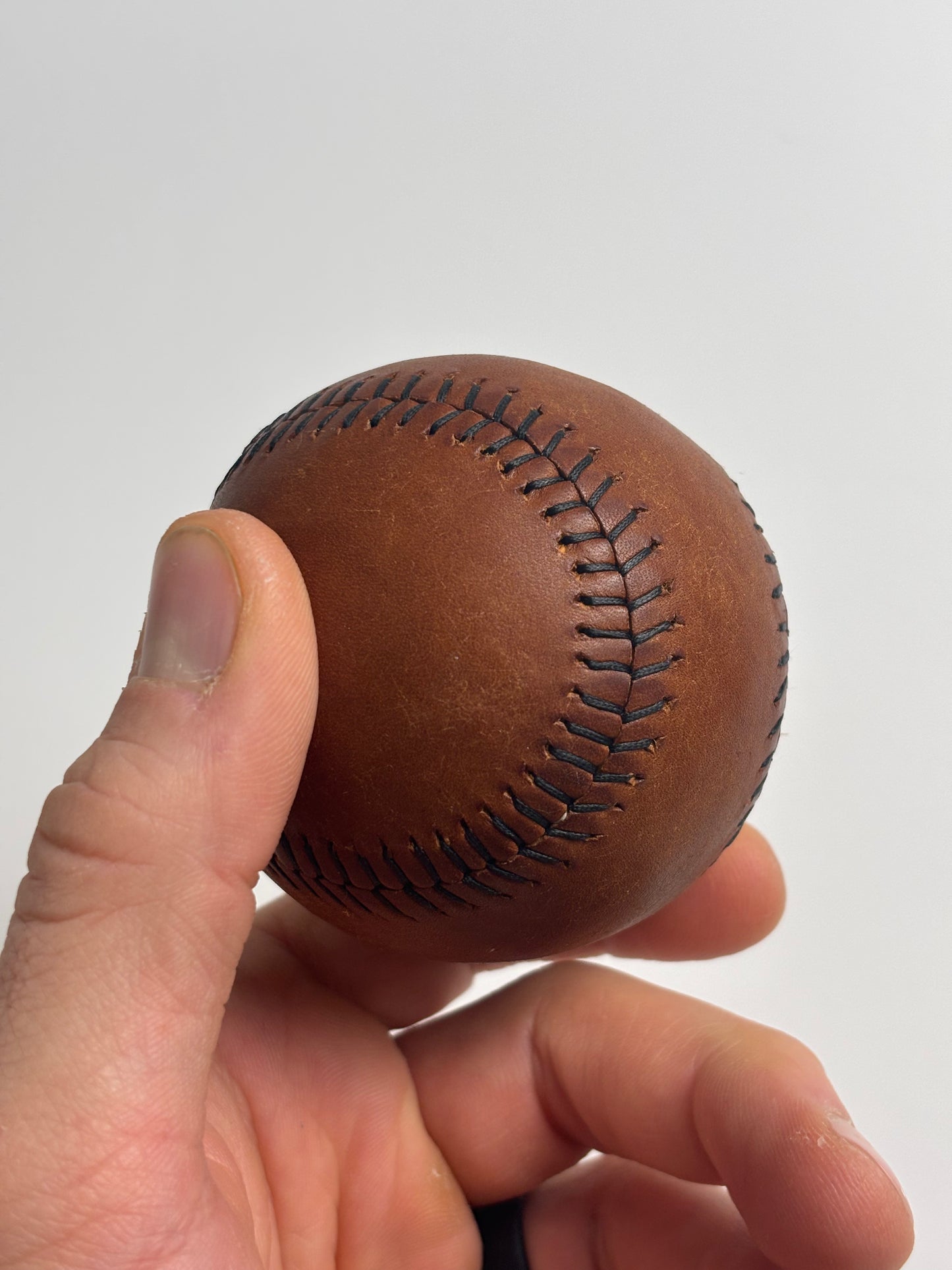 Hand stitched leather baseball